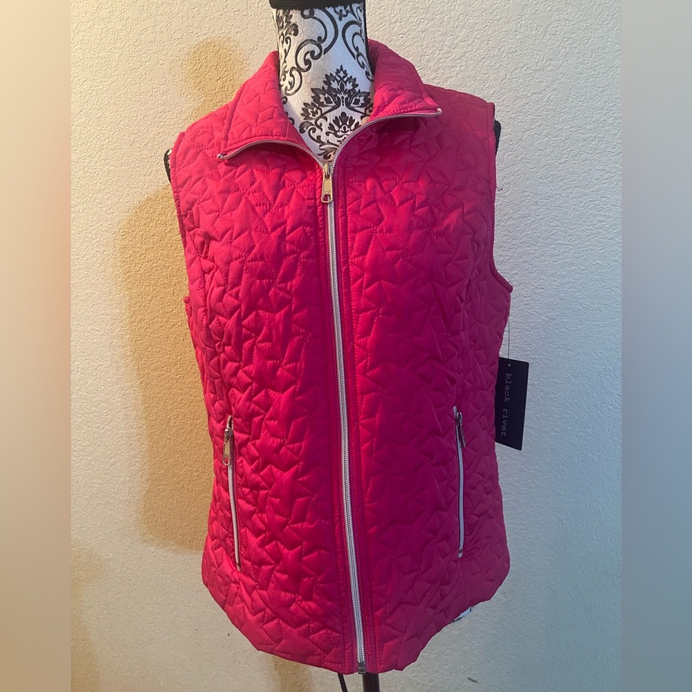 Black Rivet pink vest with silver zippers. Size medium.